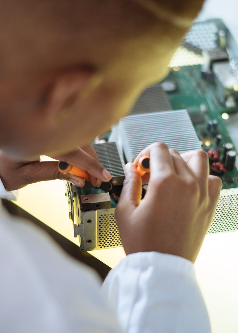 faceless professional repairer fixing video card in service center
